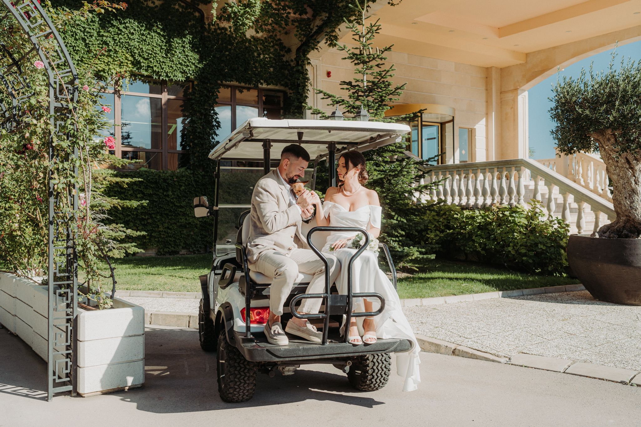 A wedding couple poses together in various romantic outdoor settings with elegant architecture and natural scenery.