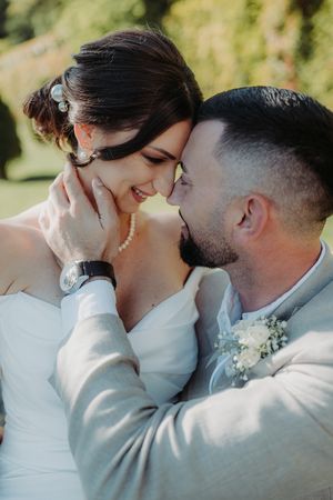 A sequence of romantic wedding photos showing a couple sharing intimate kisses in natural outdoor lighting.