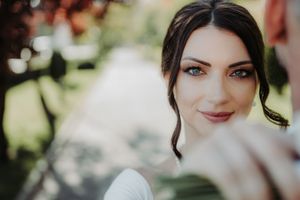 A collage of wedding photos showing close-up portraits of someone in bridal makeup and accessories.