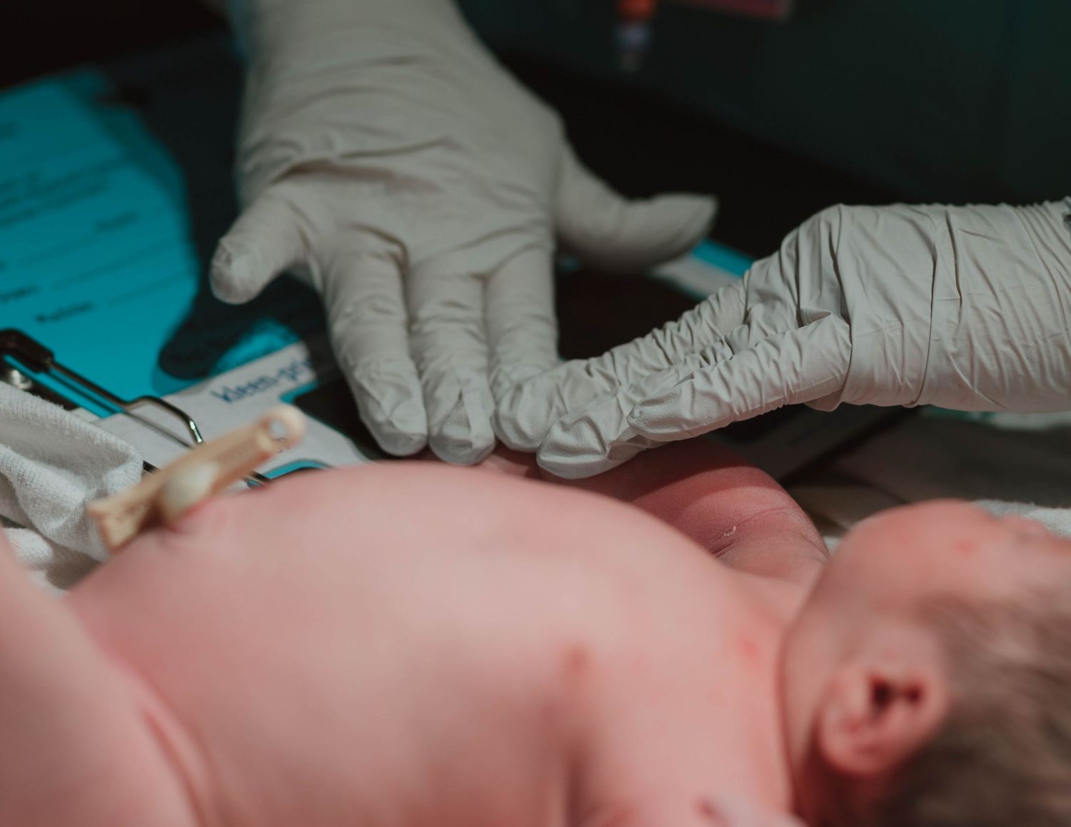 Healthcare provider wearing latex gloves administers a vaccine injection during a medical procedure.