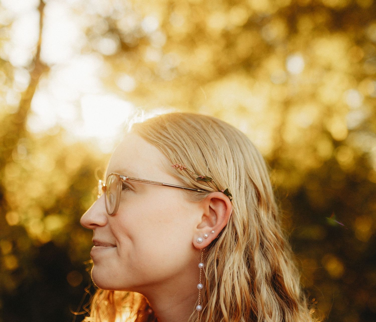 Senior girl with golden sun behind her head