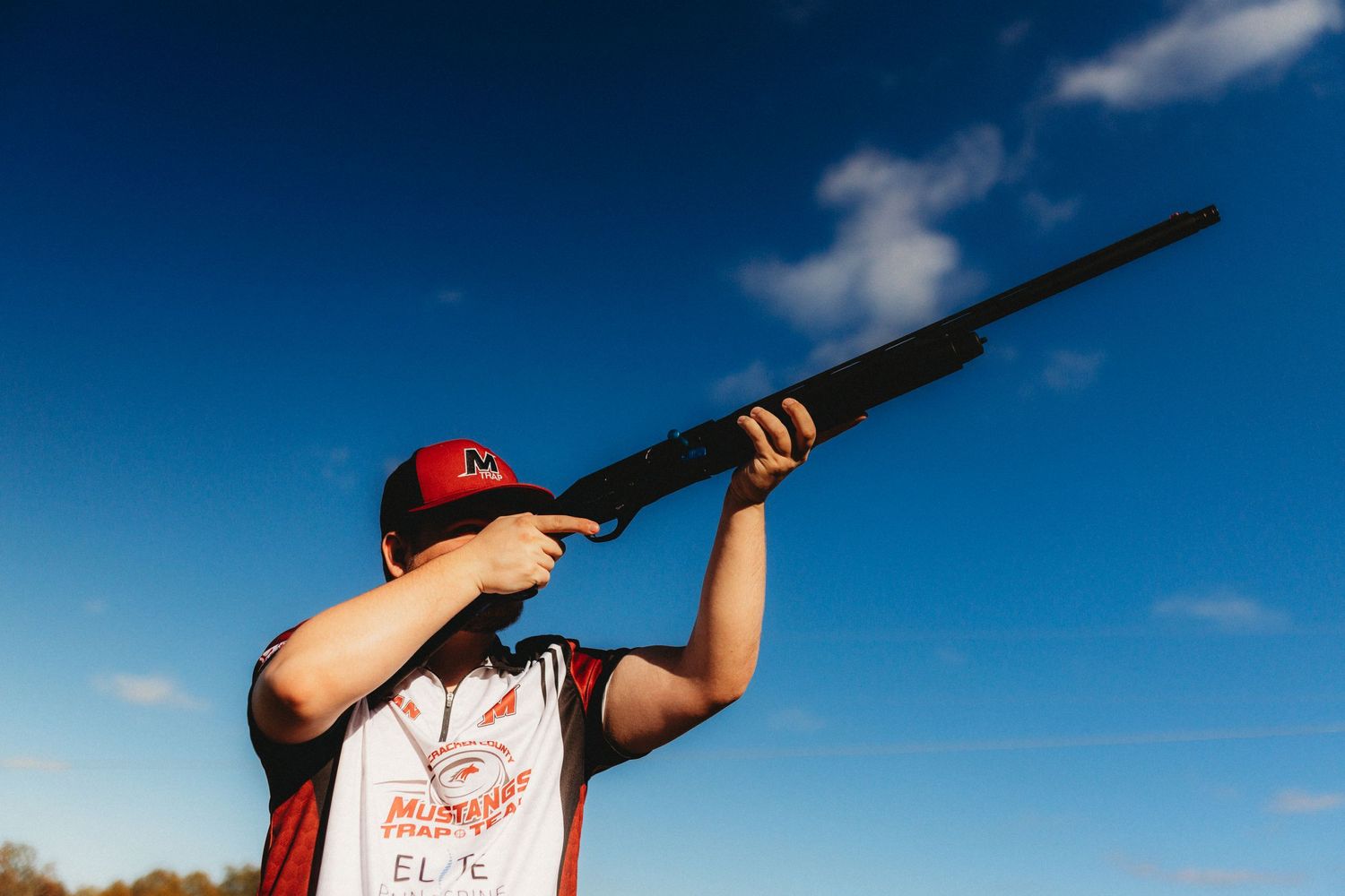 Senior boy against a blue sky