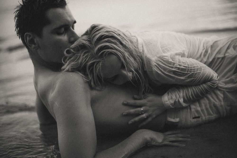 Artistic black and white sequence capturing intimate embrace.