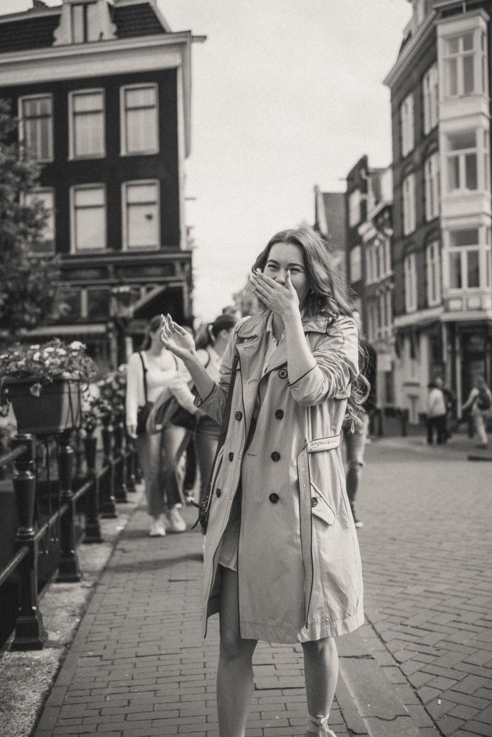 Candid street photography showing joyful moments on a historic cobblestone street.