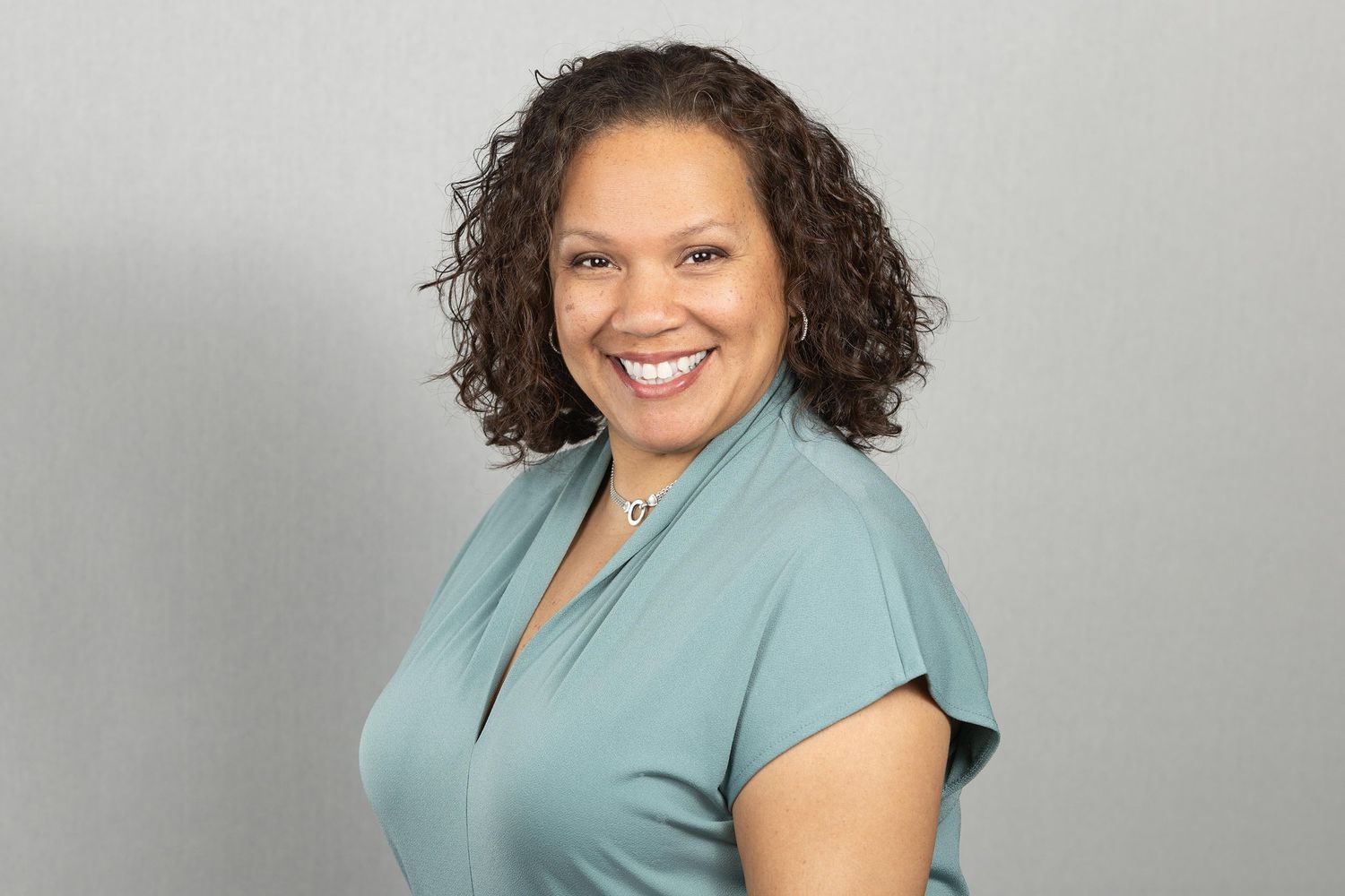 Studio-lit headshot of smiling realtor | Northern NJ professional headshot photographer