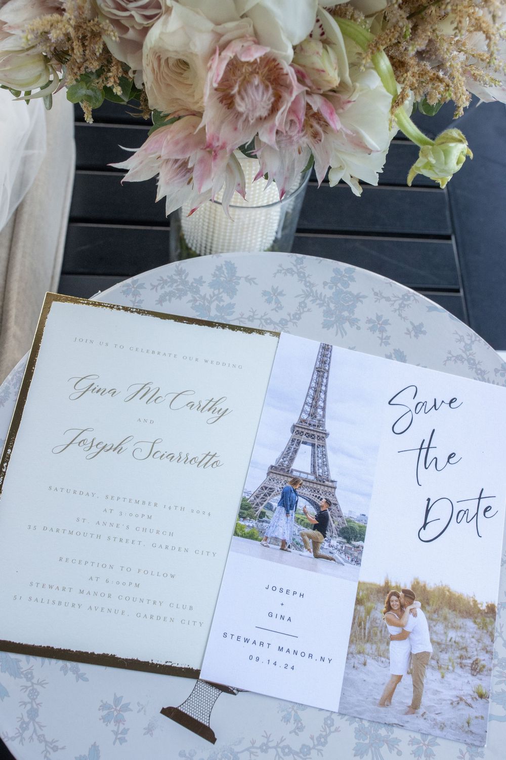 Elegant wedding invitation suite with save the date card featuring Eiffel Tower photo and floral arrangements.