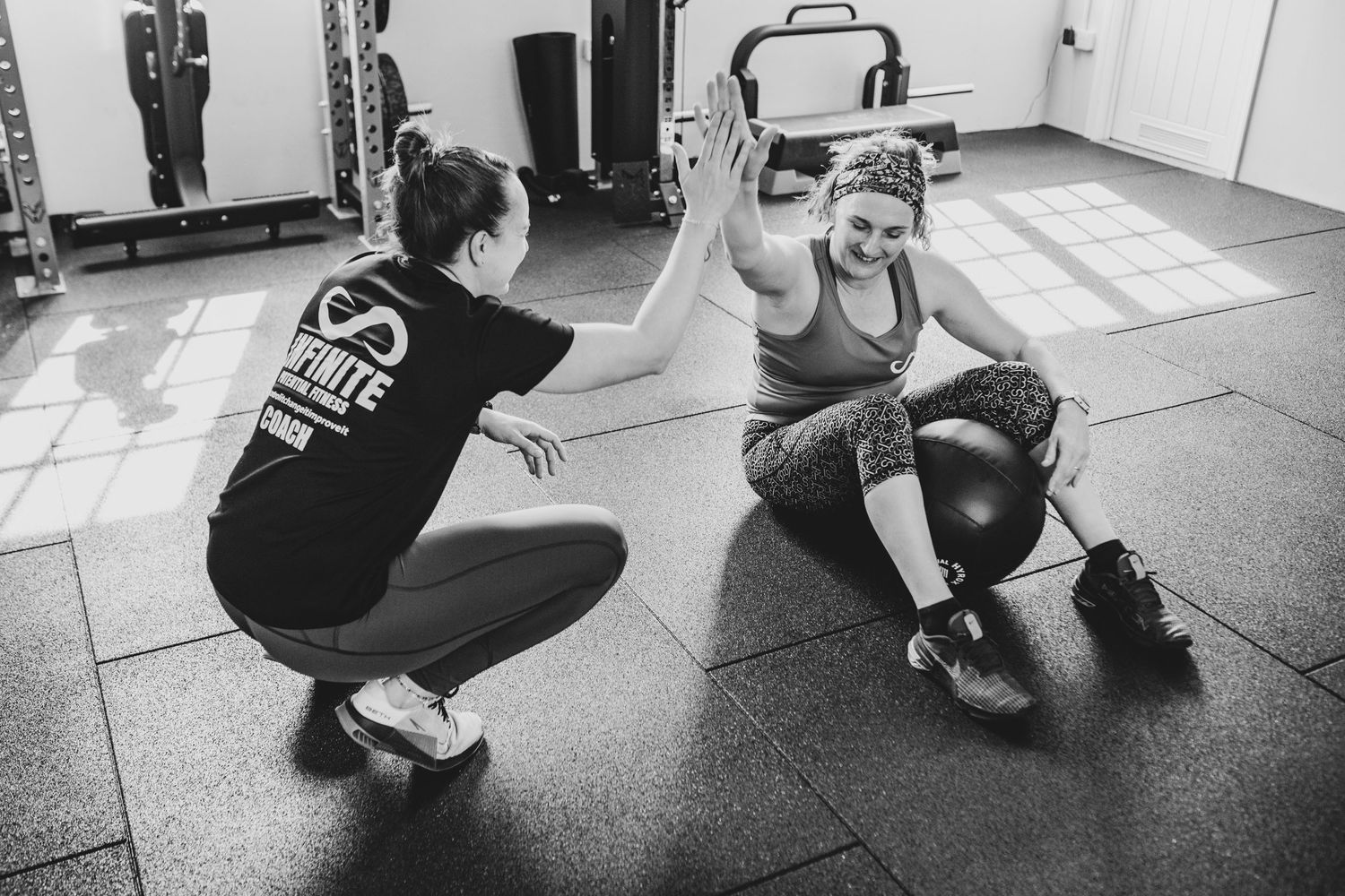 Two athletes high-fiving during an intense workout session in a gym.
Small Business Storytelling photography