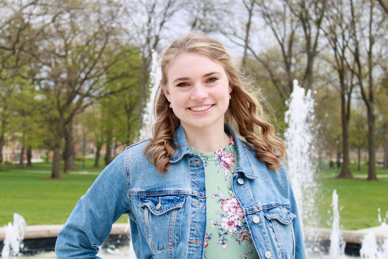 Portrait of girl with light brown hair in jean jacket