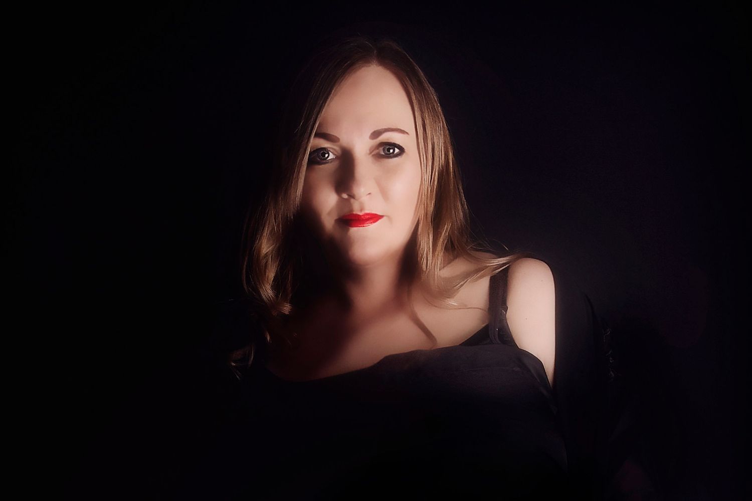 image of dark background, with shadows. Profile image with red lips