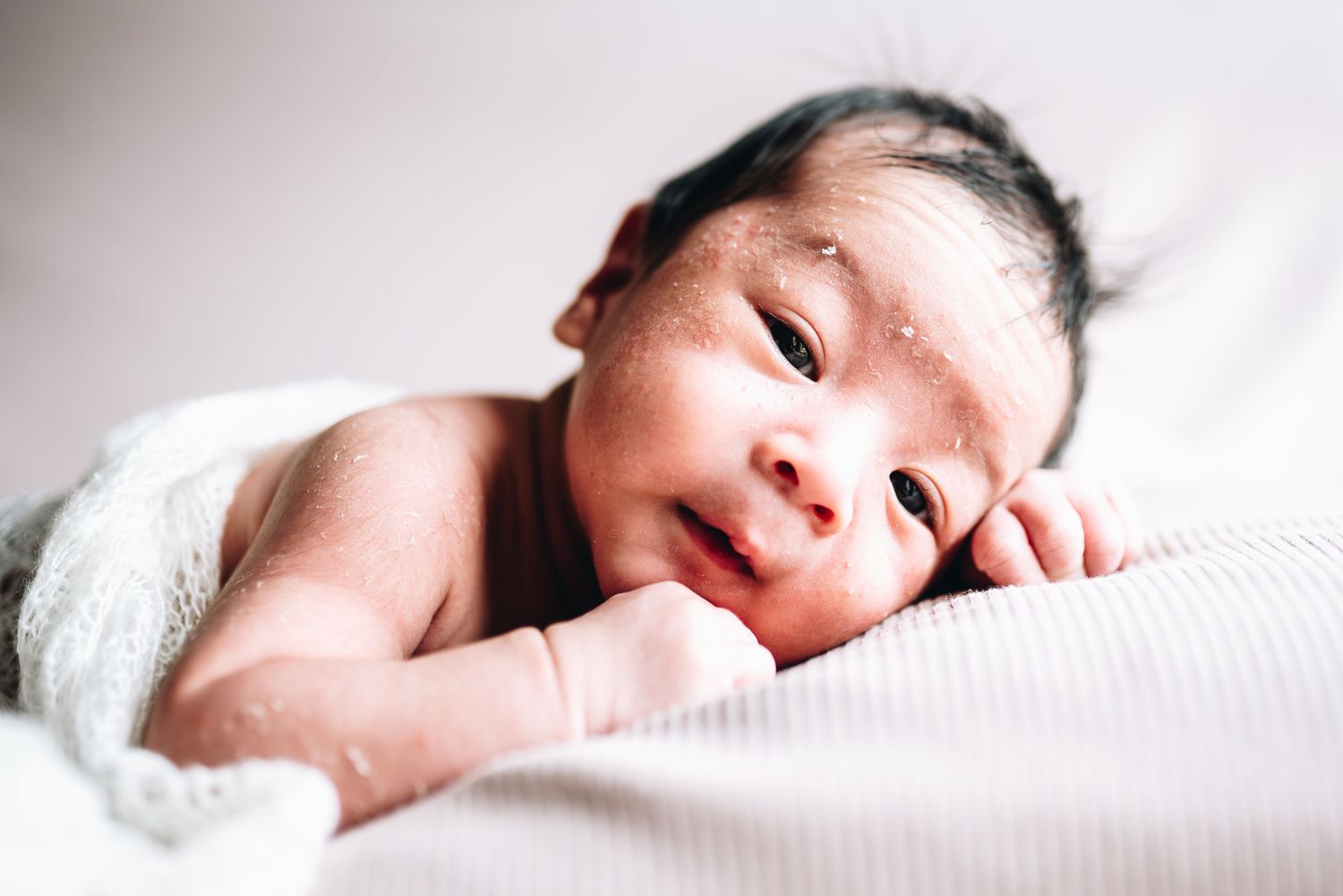 Cute asian baby looking at the camera during a newborn photoshoot in Melbourne by Melbourne maternity, newborn and family photographer Pei A