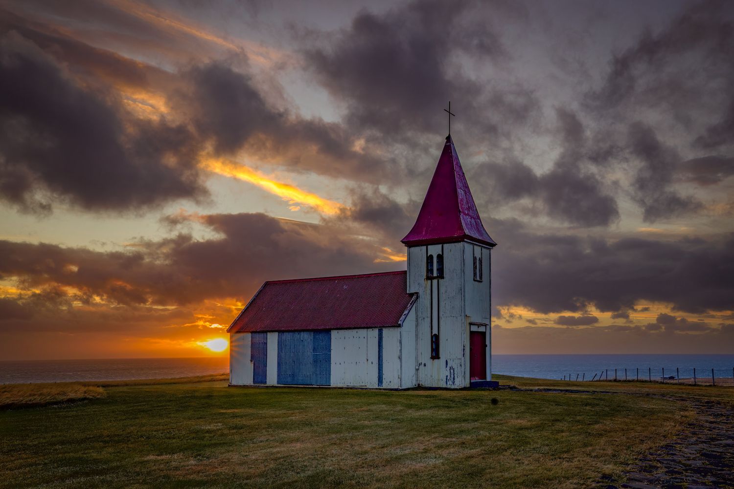 Sunrise at one of the many white churches in Iceland
