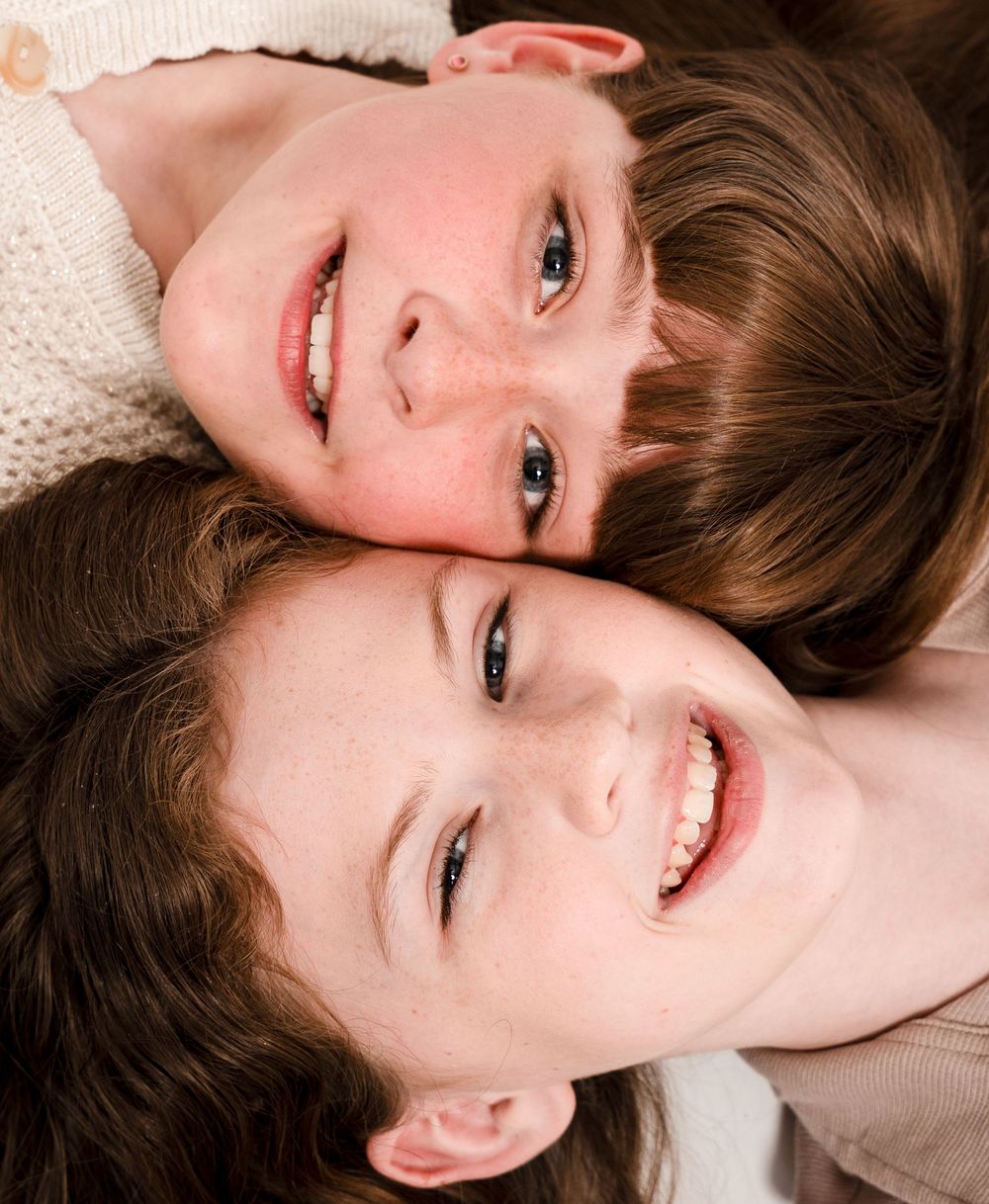 A sequence of five portrait photographs capturing the same joyful expression in varying poses.