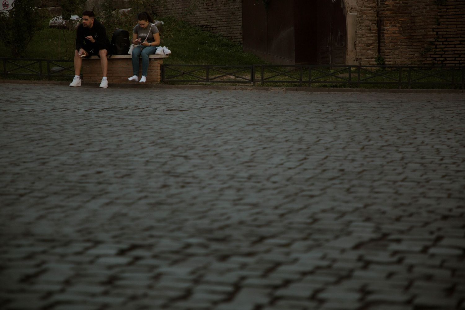 street photographer destination photographer cobblestone candid people low light
