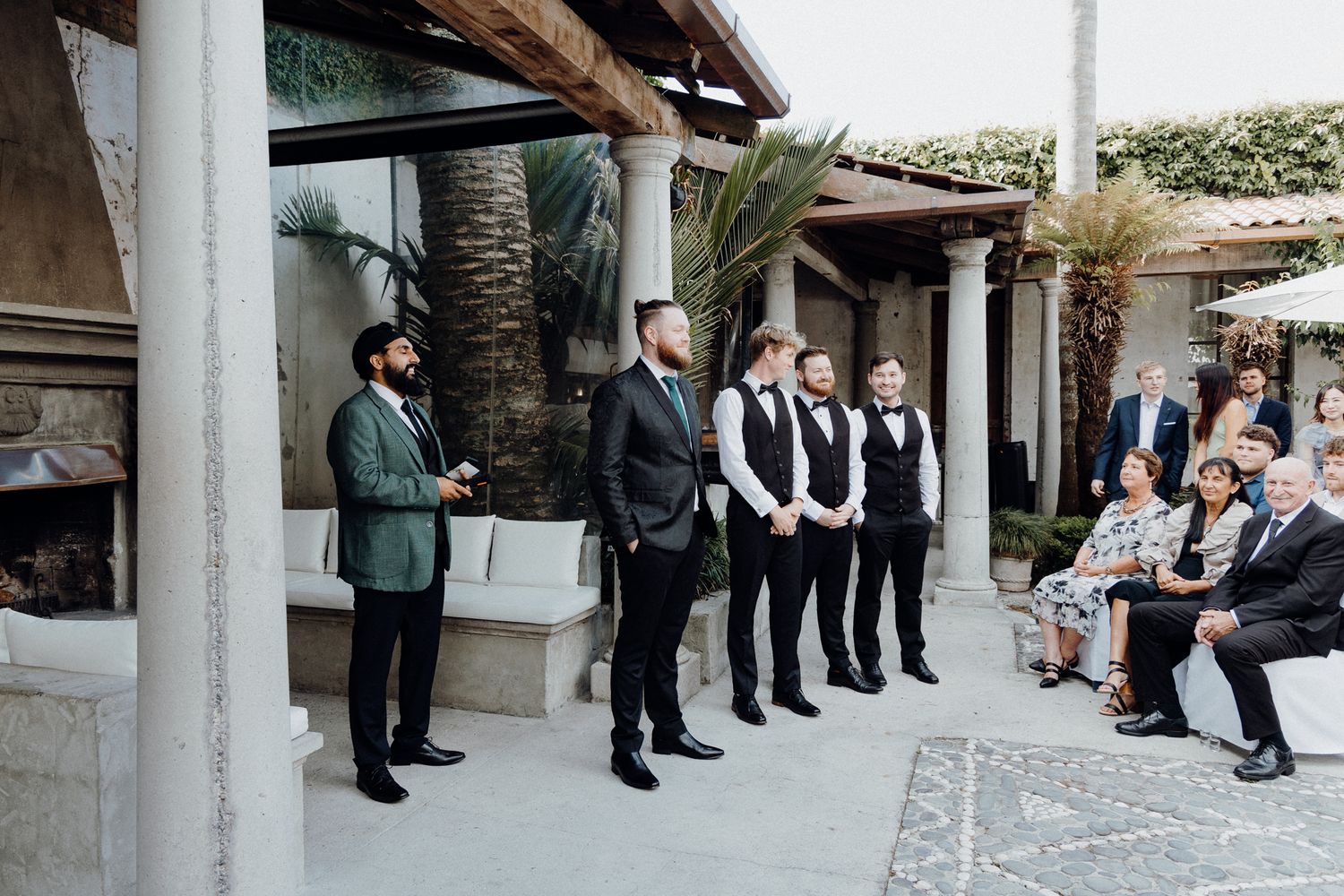 The groom waits for his bride's entrance for their wedding ceremony, captured by Apertured Media Auckland Wedding Photographer.