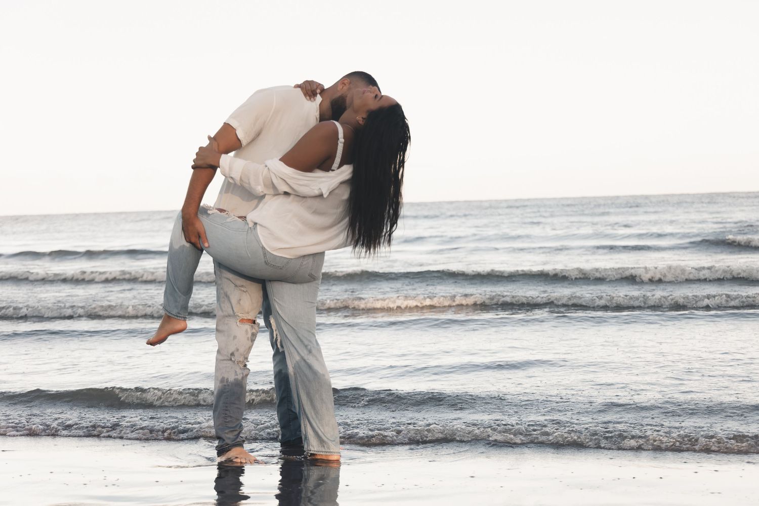 Sunrise kisses & waves at Edgewater Beach in Cleveland, Ohio — love & laughter reflected at the edge of Lake Erie for this couples session.