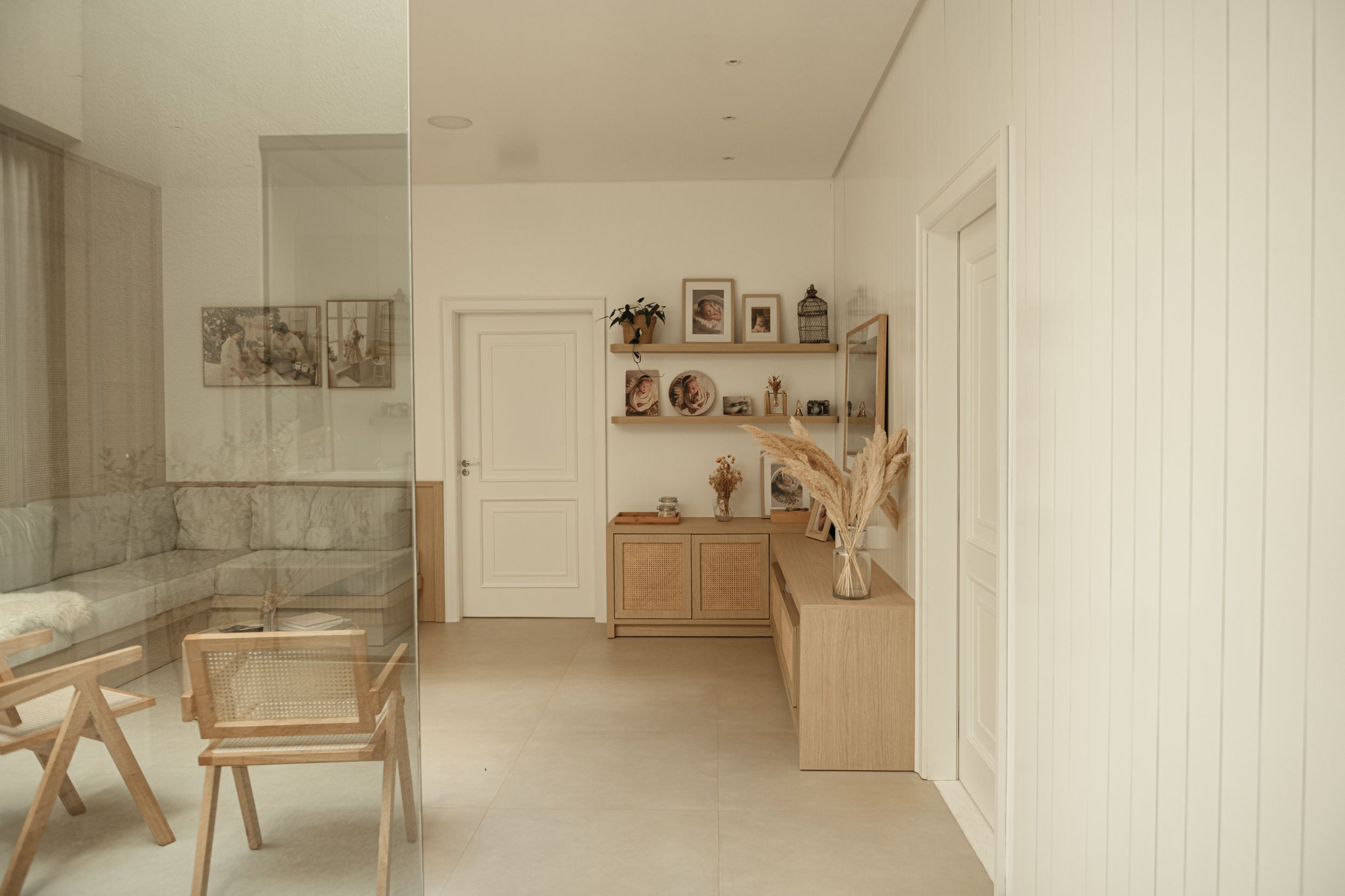 Clean minimalist room with wooden furniture and decorative wall shelves.