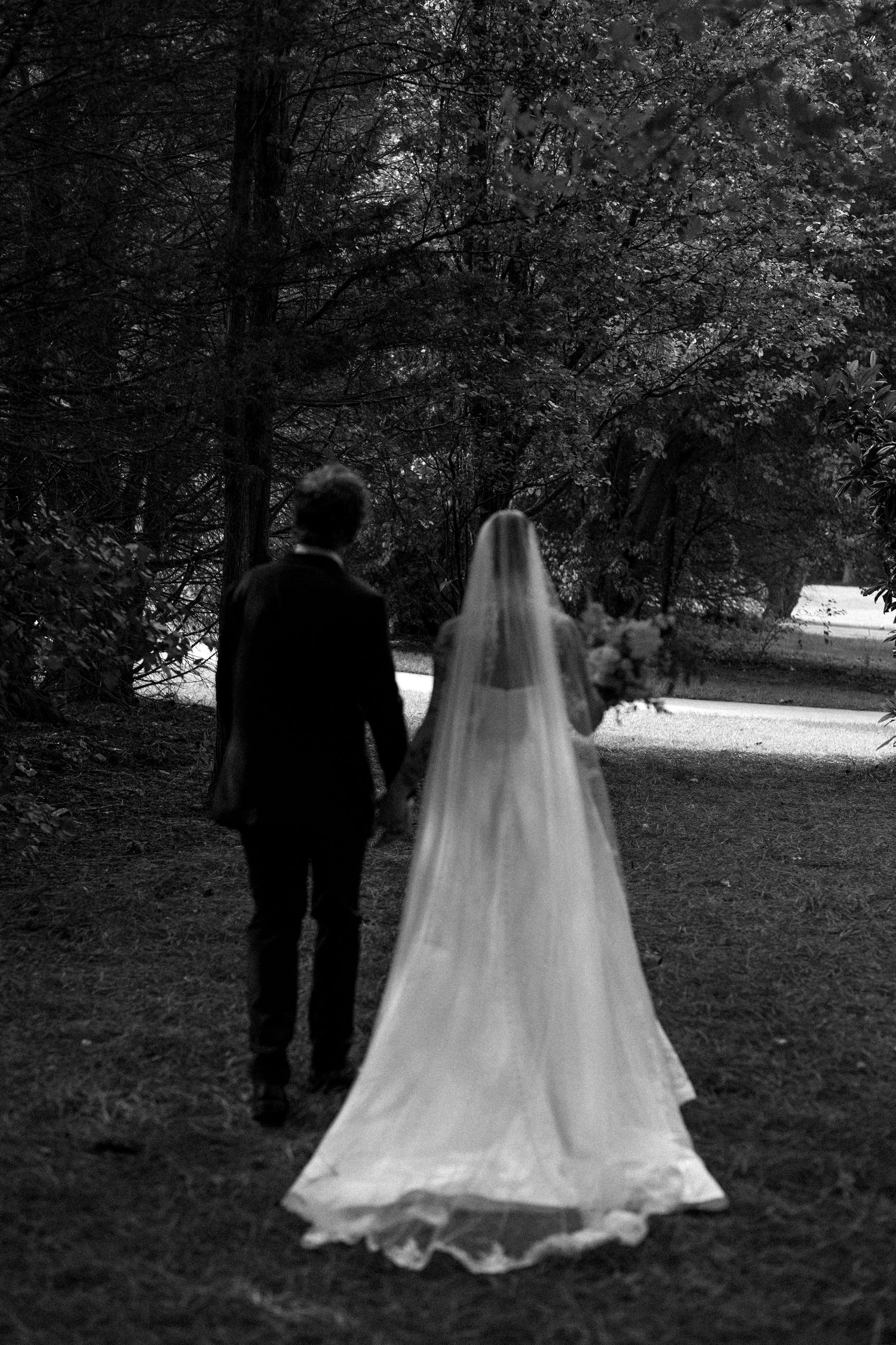 A black and white photo sequence shows a couple walking through a wooded area in wedding attire.