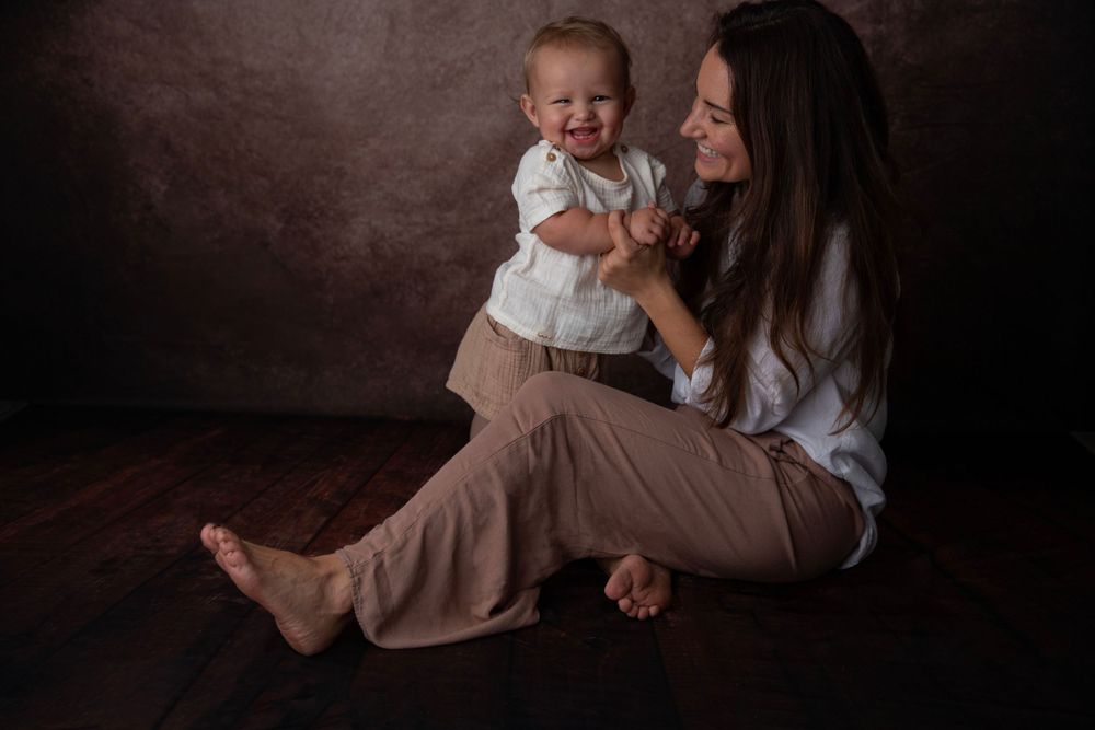 Mother holding baby during Central Florida studio photography session.