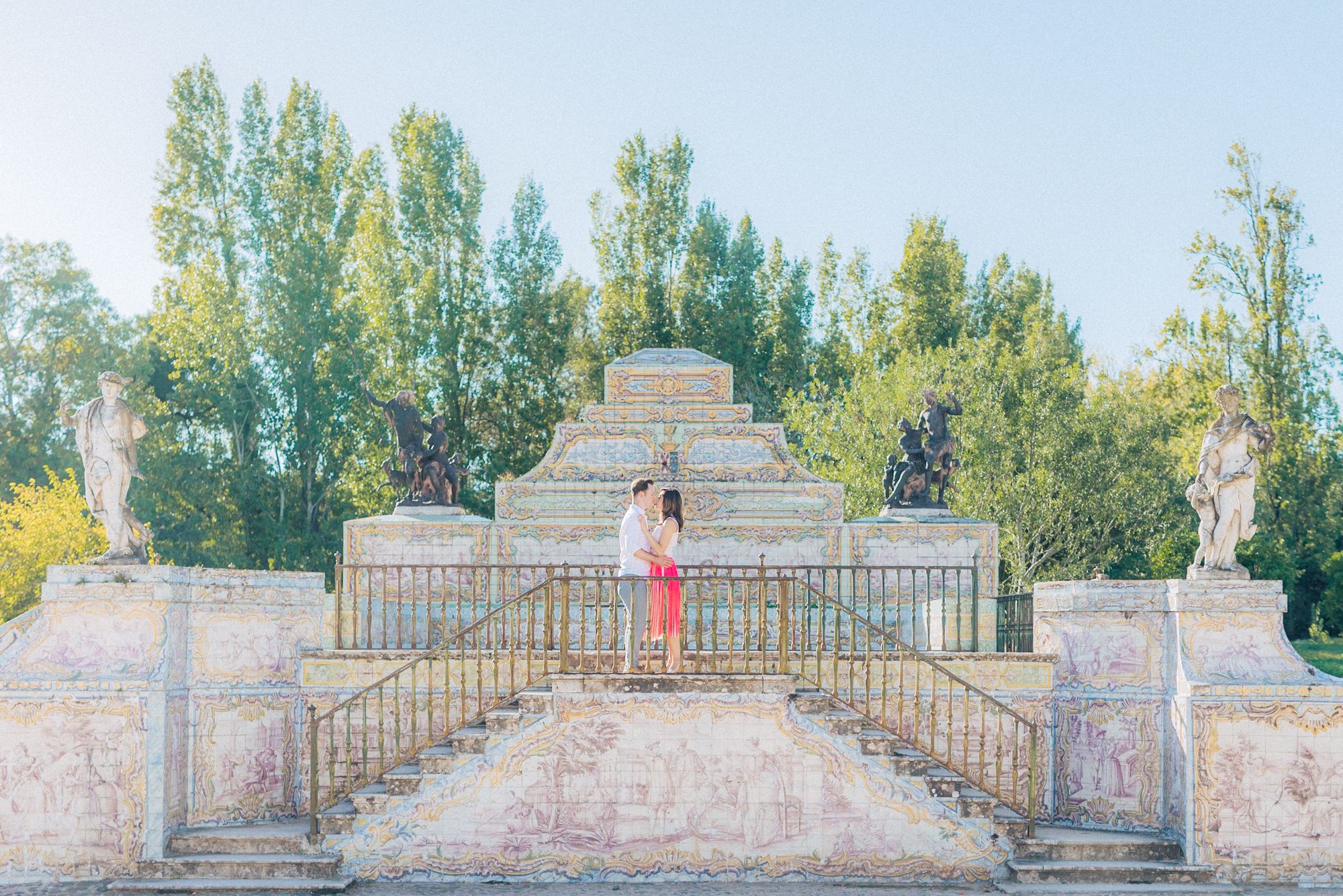 intimate kiss form couple on an engagement photoshoot at Queluz Palace. captured by a Portugal destination wedding photographer