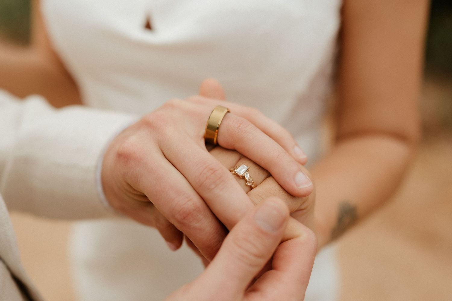 Close-up shot of wedding rings and hands symbolizing marriage commitment.