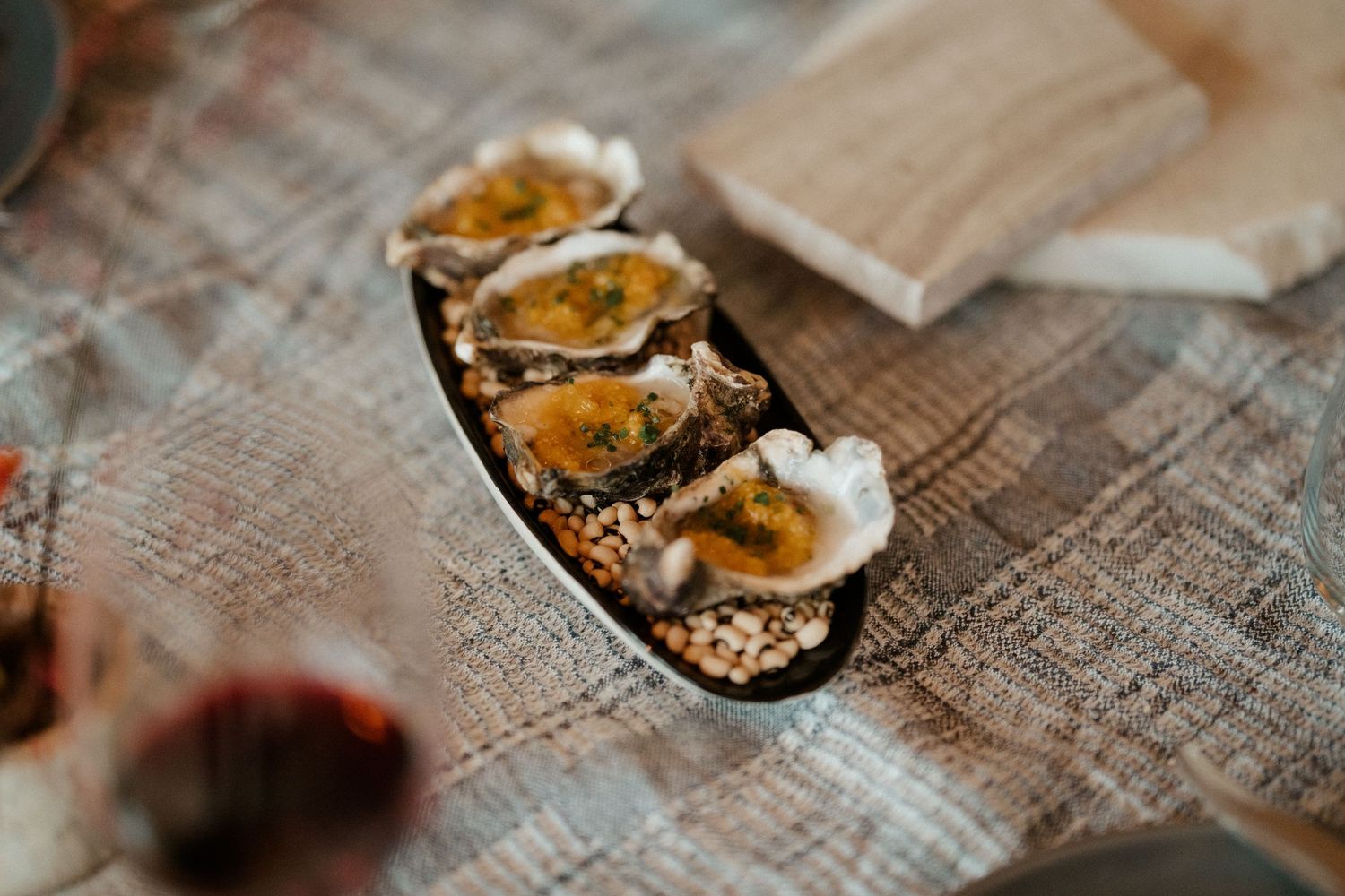 Fresh oysters served on a rustic surface with elegant presentation.