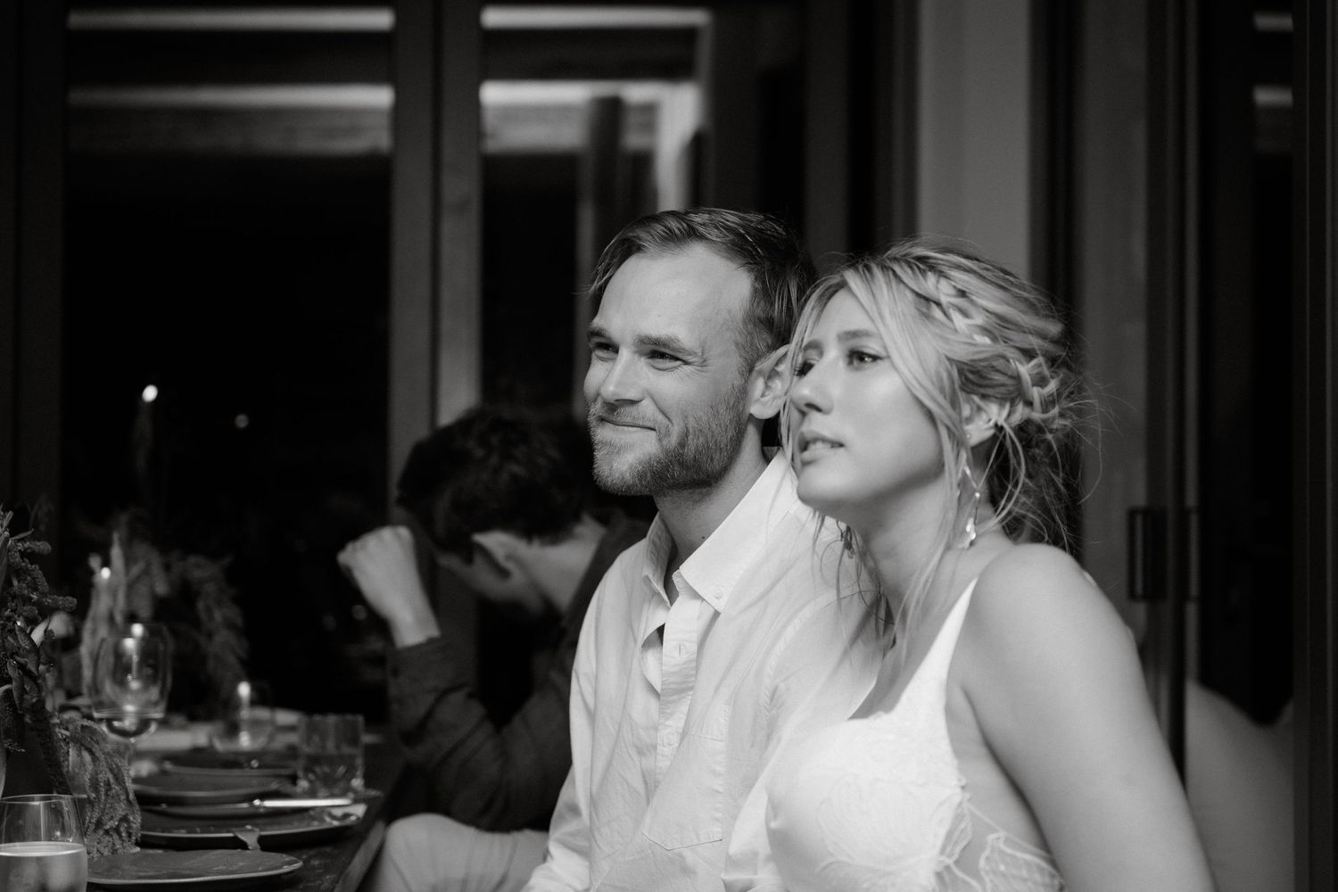 An intimate black and white reception moment during wedding celebrations.