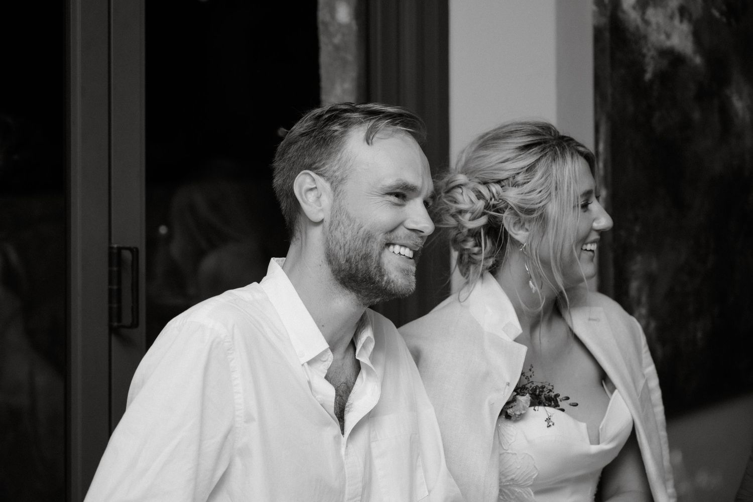 A couple shares a joyful moment during their wedding celebration.