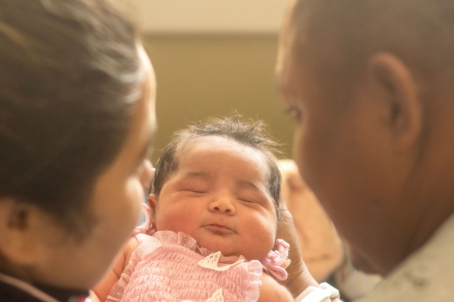 A series of heartwarming photos showing babies and children playing and interacting together in a classroom setting.