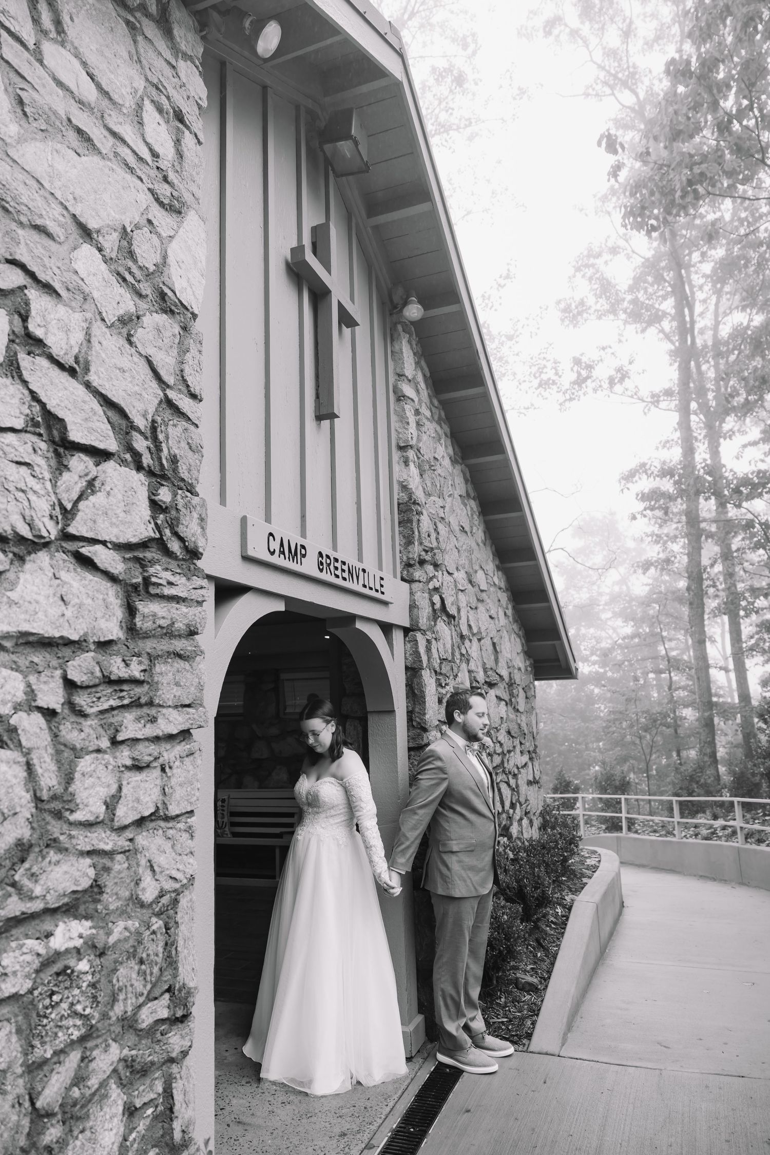 A black and white photo series showing a couple in formal wedding attire outside a rustic stone building entrance.