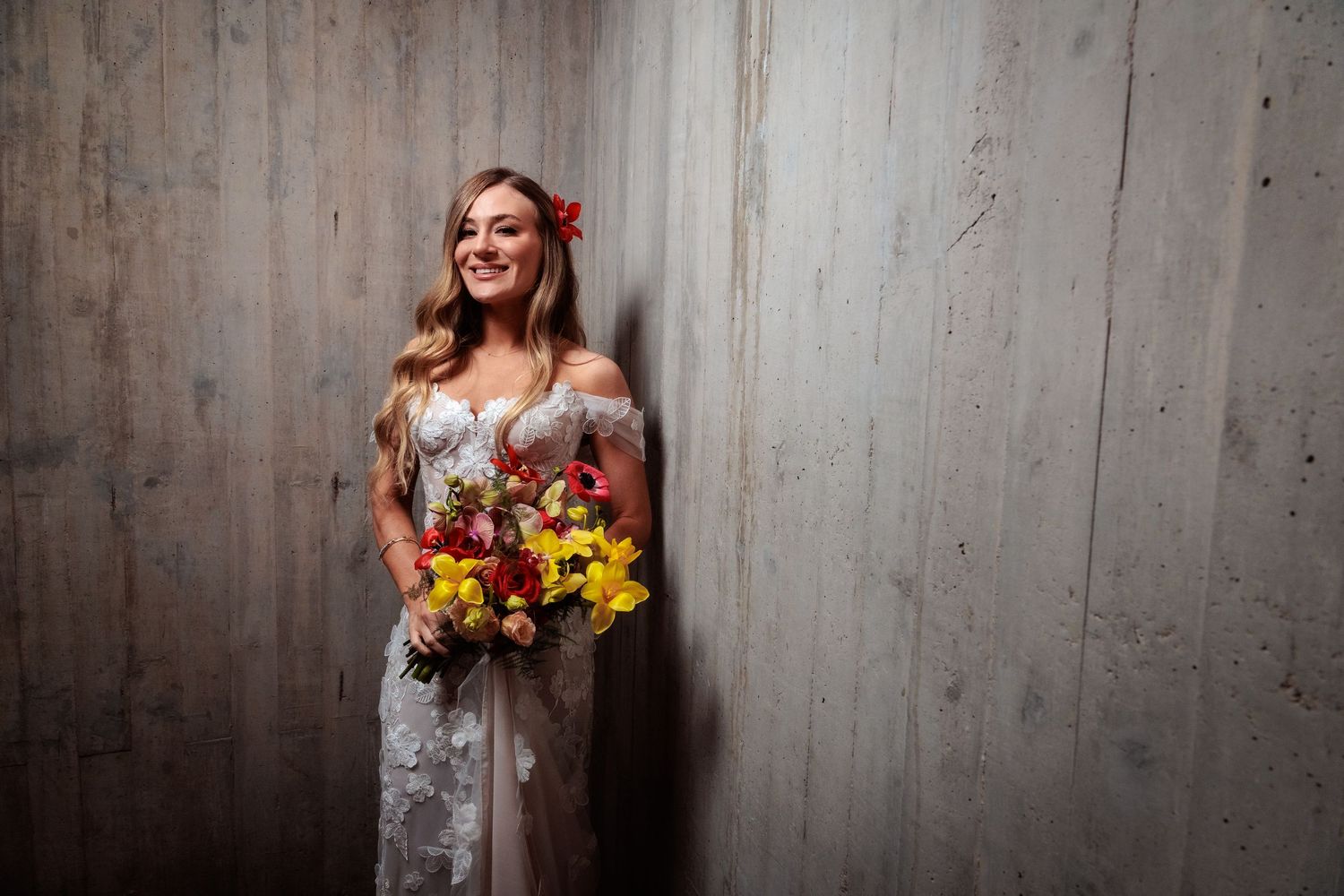 Artistic portrait series against a textured concrete wall showing joyful expressions and movement.
