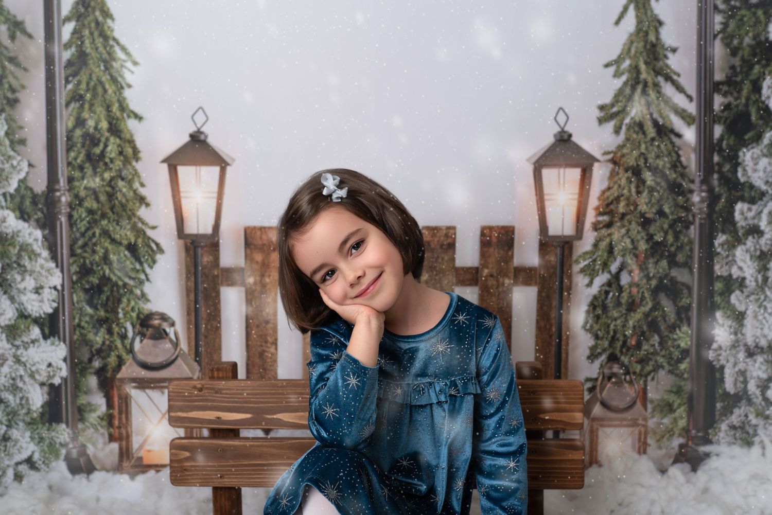 A denim jacket worn in a rustic outdoor setting with wooden fence and evergreen trees in the background.