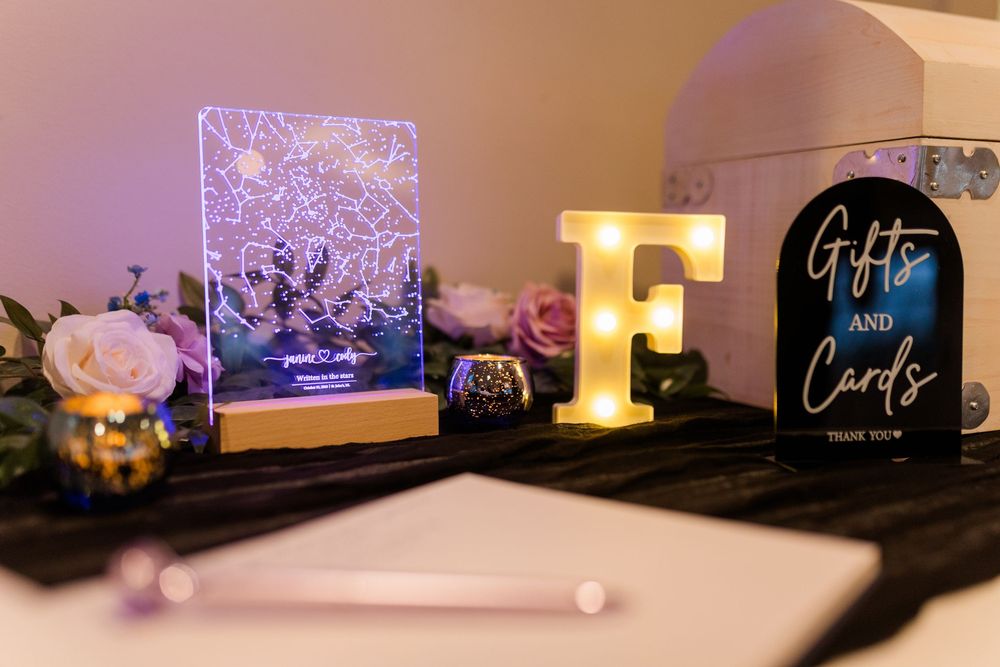 A cozy bedroom with soft lighting features illuminated candles and decorative elements creating a warm ambiance.