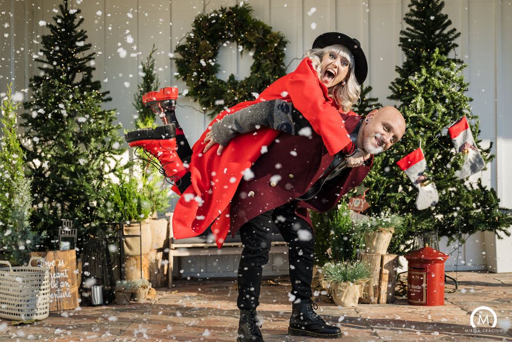 A sequence of winter action shots shows someone jumping in red outerwear against a snowy evergreen backdrop.