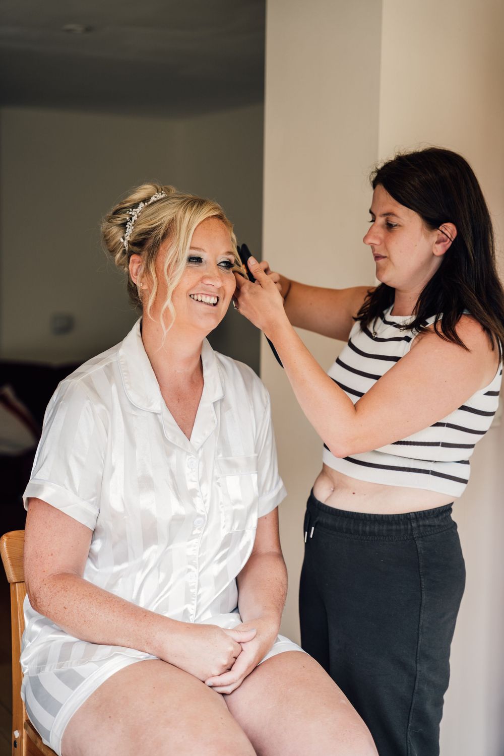 Getting ready scene with joyful interactions in a bright indoor setting.