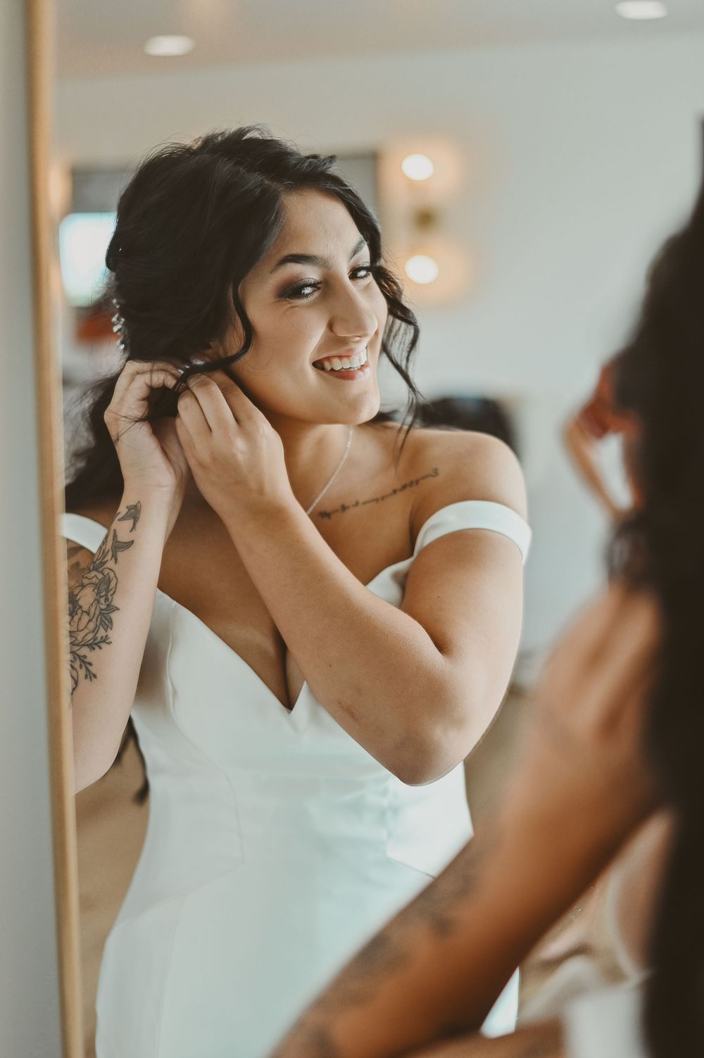 Close-up shots of someone putting on earrings and getting ready for a special occasion.