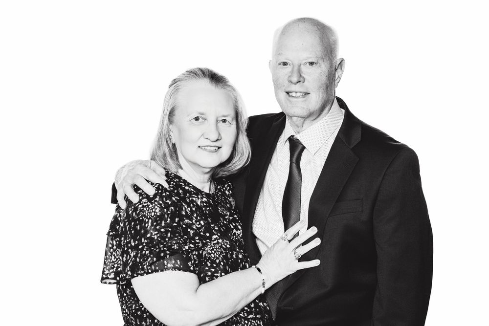 Three black and white studio portraits of couples in formal attire standing together and smiling at the camera.