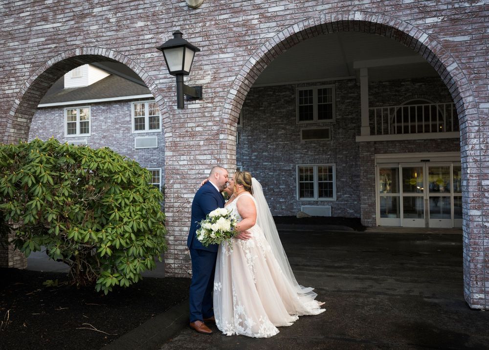 Wedding photo sequence under brick archways with dramatic lighting and architecture.