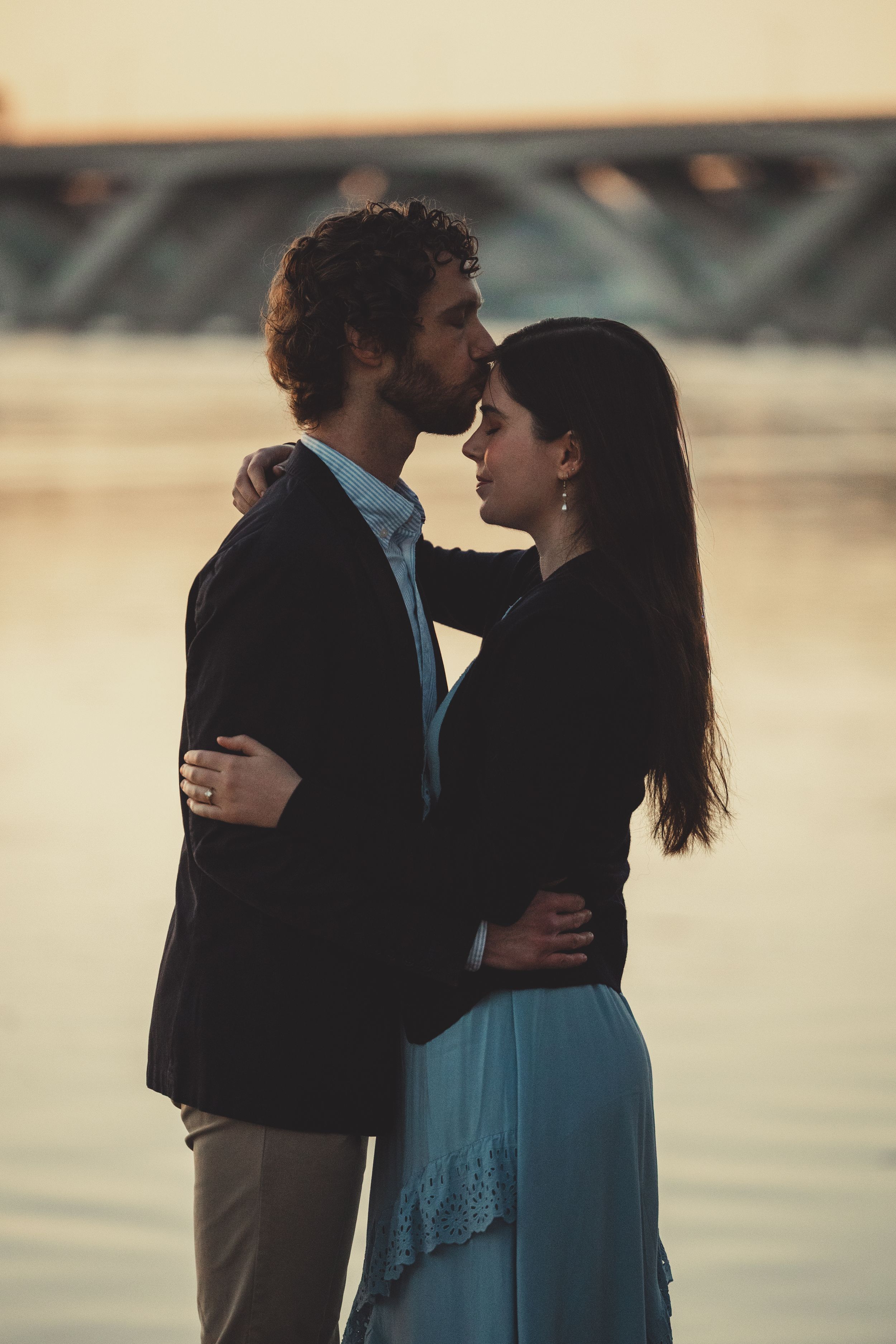 A couple in silhouette shares an intimate moment at sunset with multiple similar poses shown in sequence.