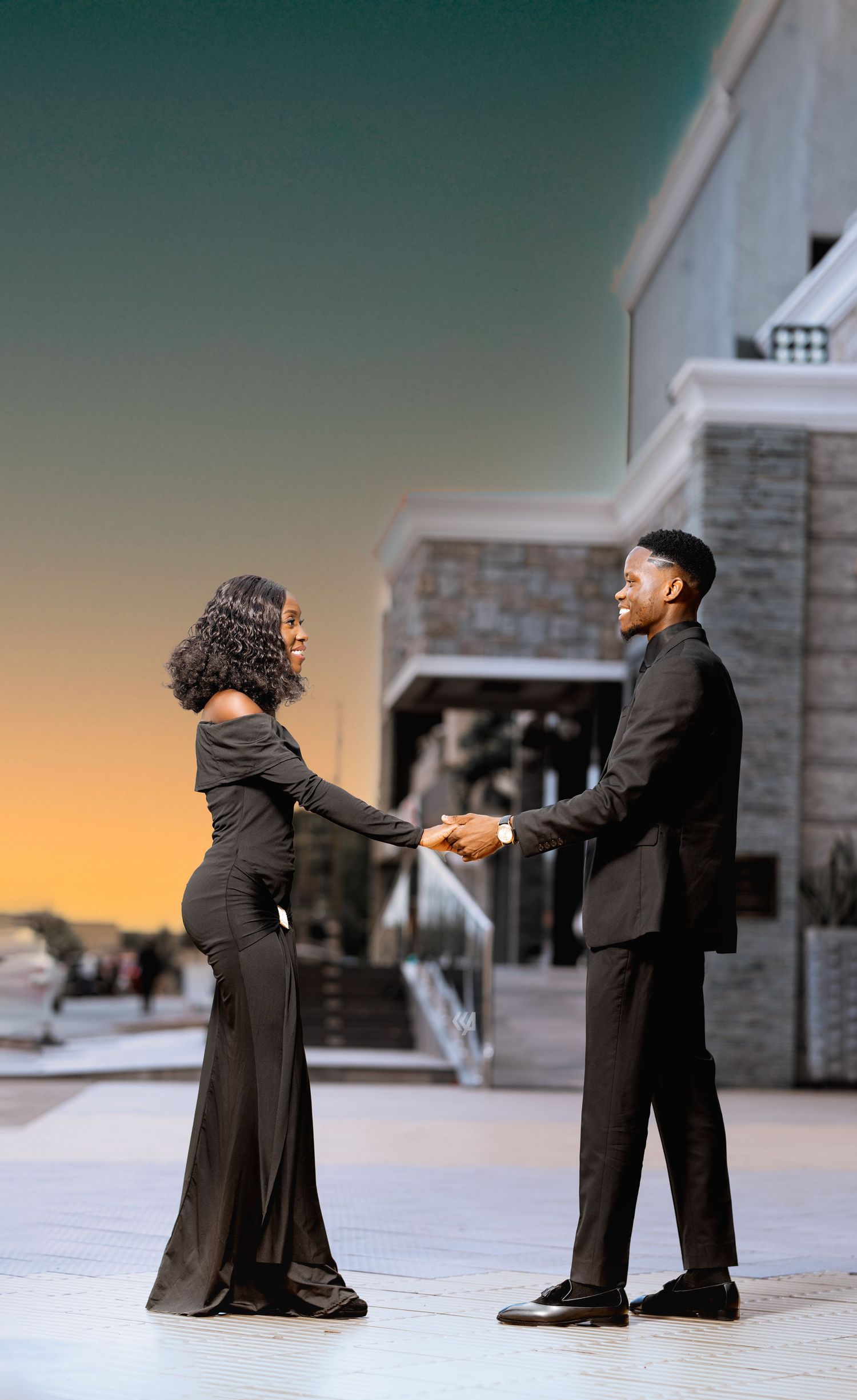 A series of artistic silhouettes showing a couple's dance sequence against a sunset backdrop.