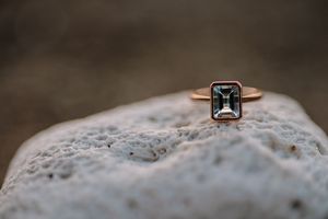Close-up macro shots of a diamond engagement ring with intricate details and sparkles.