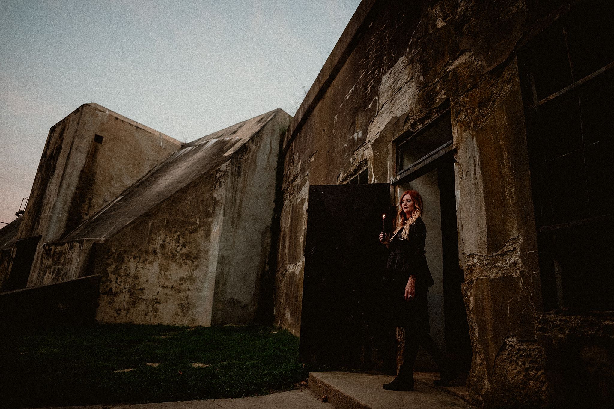 Weathered stone archways and corridors create a dramatic architectural perspective in an ancient building.