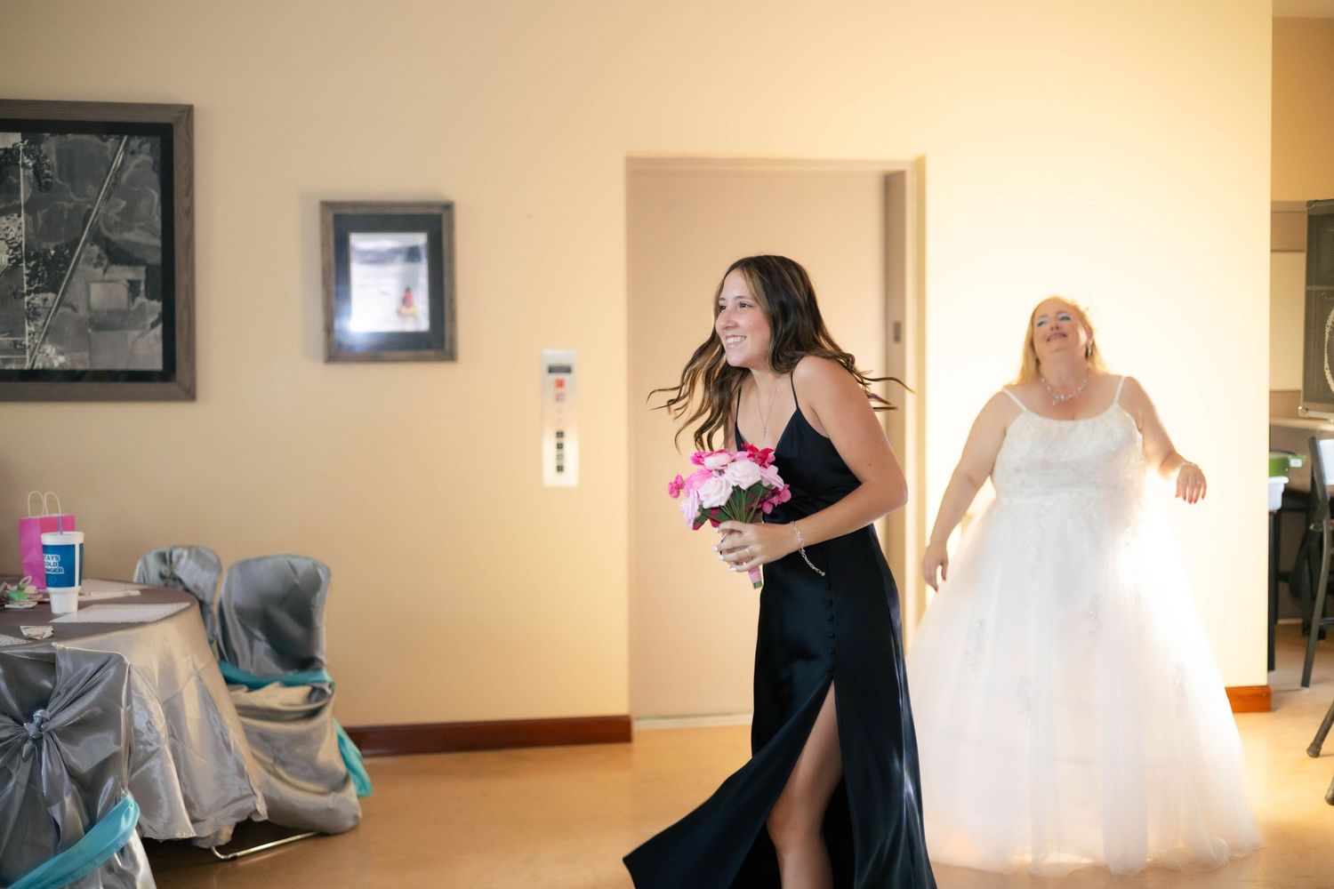 Bride and groom wedding reception flower toss in Chatham Christian Assembly in Chatham, Illinois