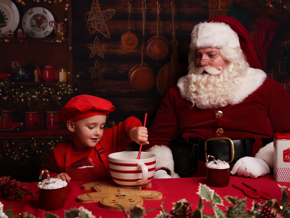A festive Christmas scene with cookies, milk, and holiday decorations in a cozy red-lit setting.