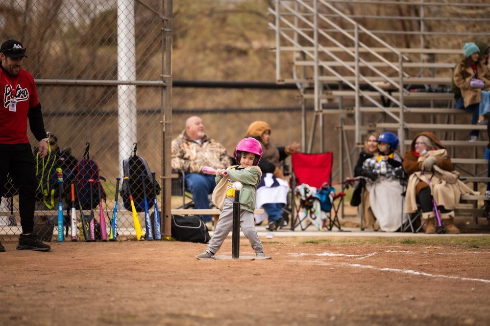 Sports photography teeball girl swinging the batt at Petroglyph Little League