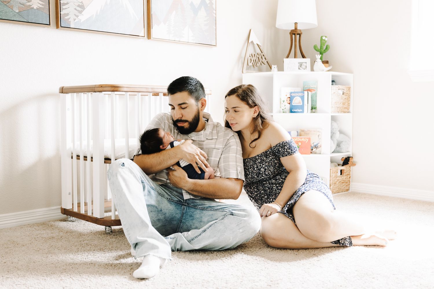 newborn lifestyle photoshoot of baby girl in her crib. Greeley colorado new born photography