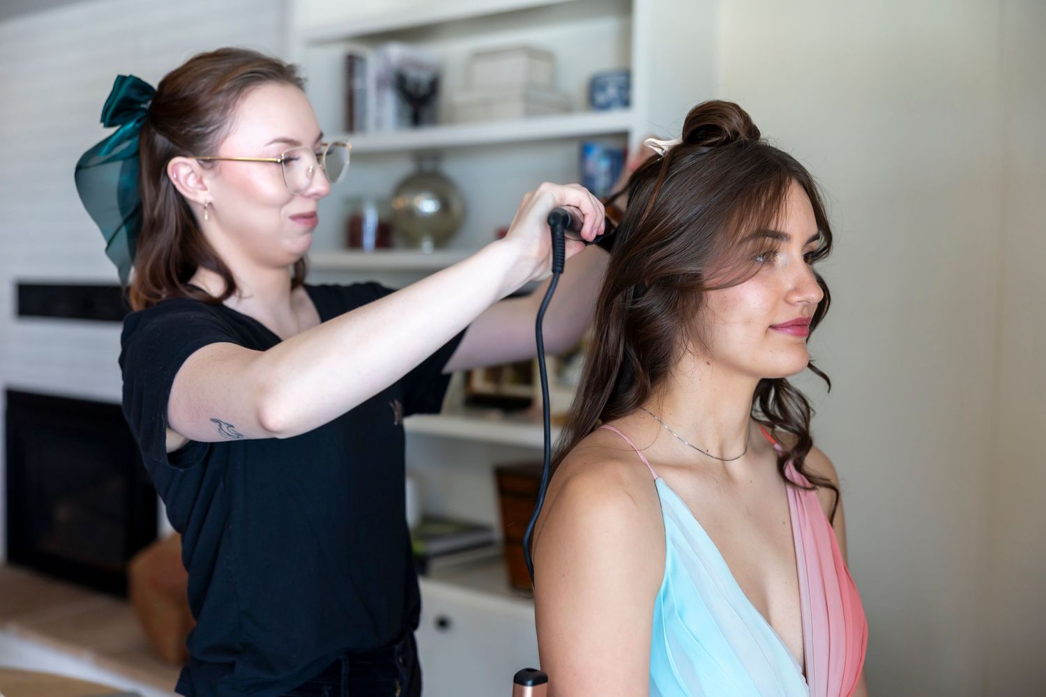 hair stylist curling hair