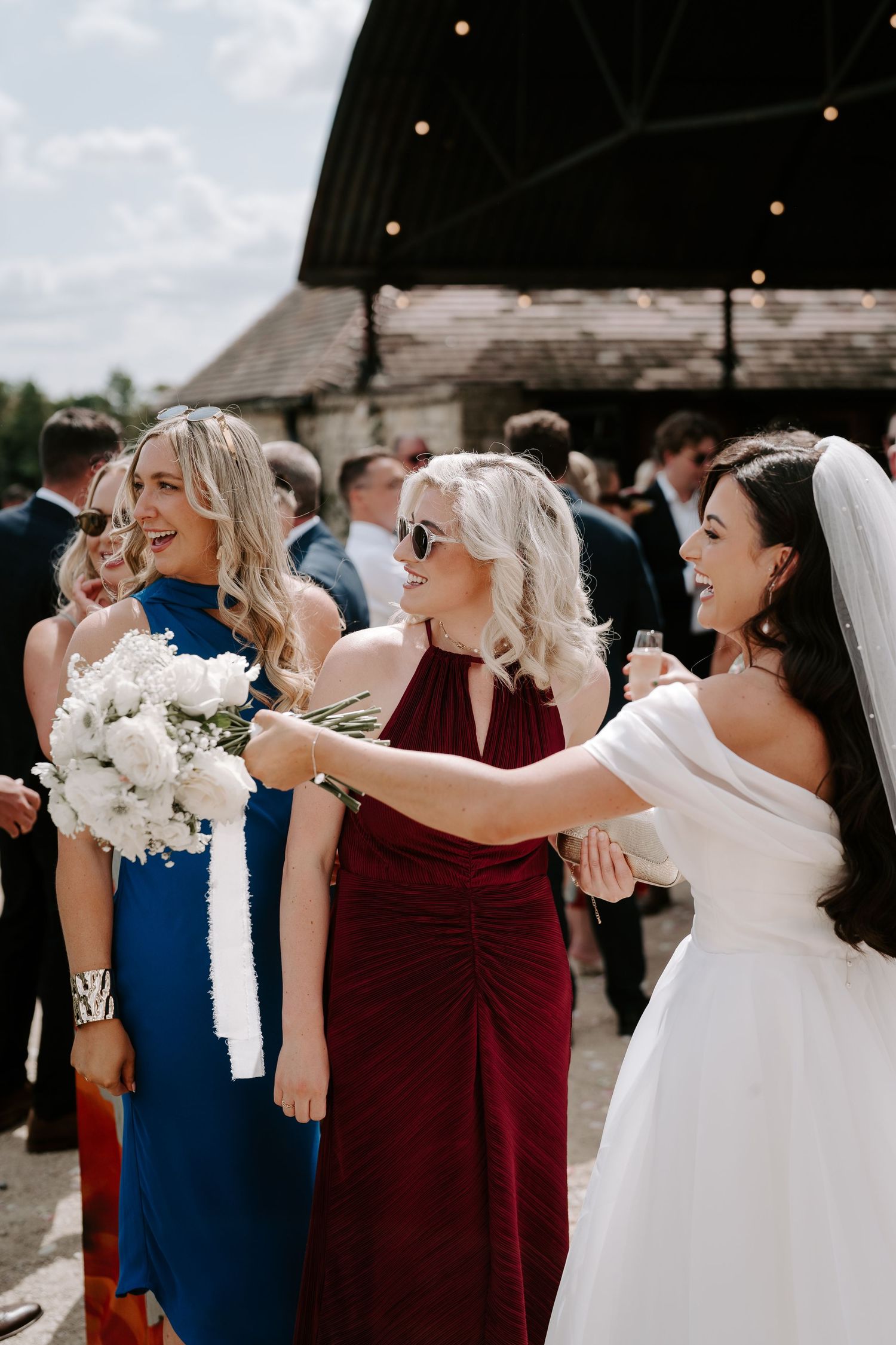 bride greeting wedding guests at yardspace old gore in cirencester