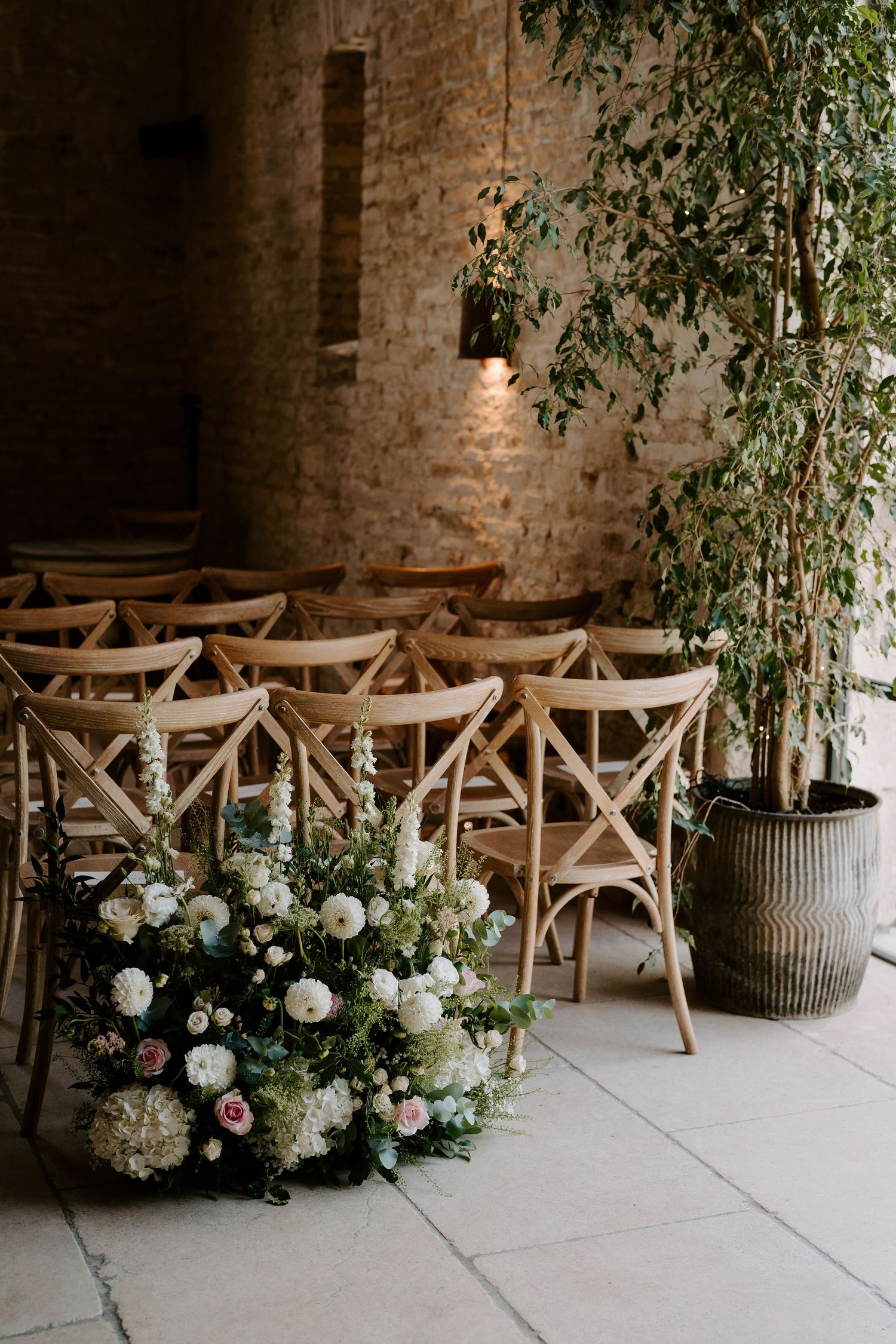 wedding flowers and ceremony room at yardspace old gore in cirencester