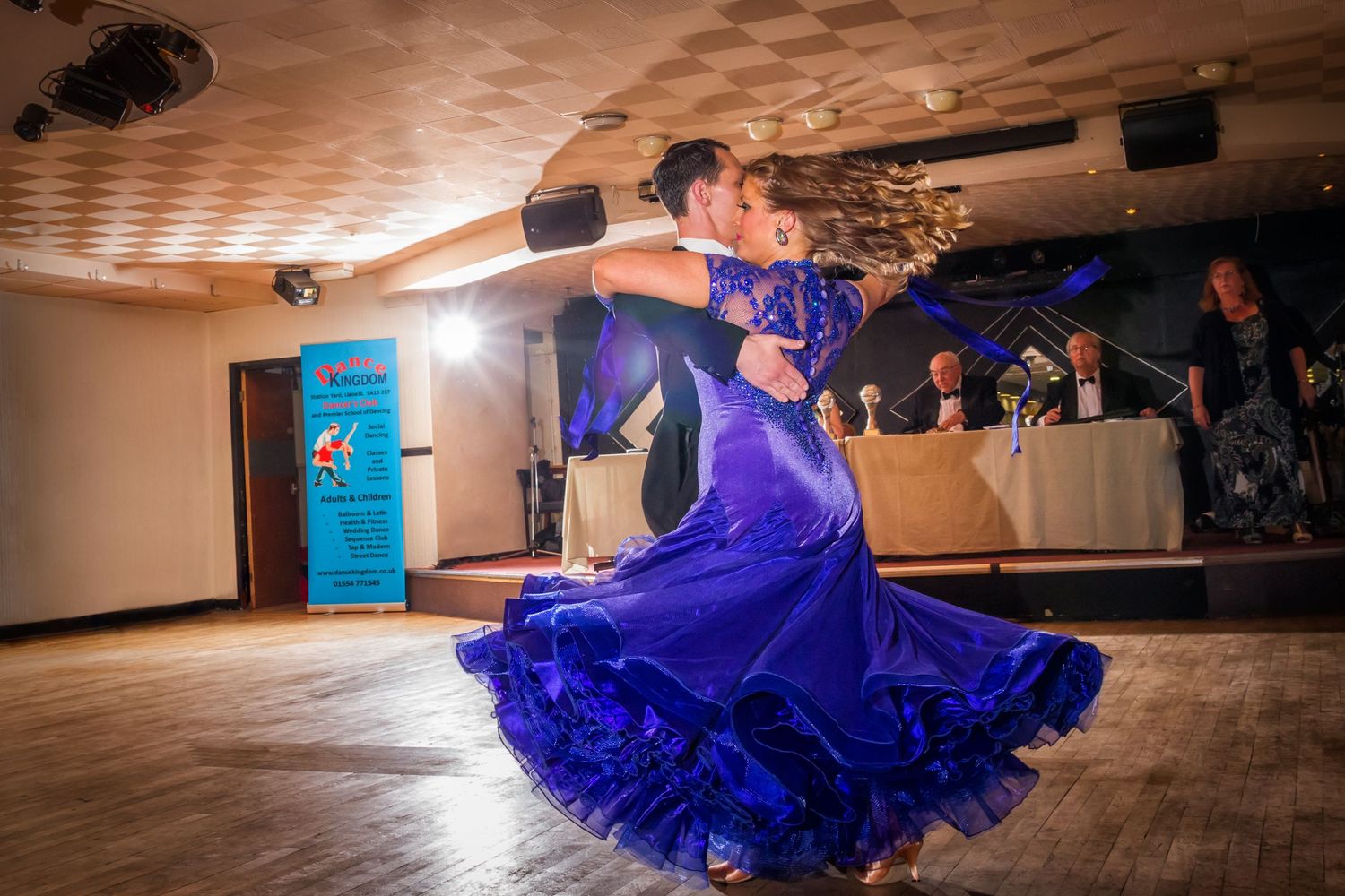 Stunning photograph of the ballroom dancing couple, Phillip and Gaynor Evans, in movement.