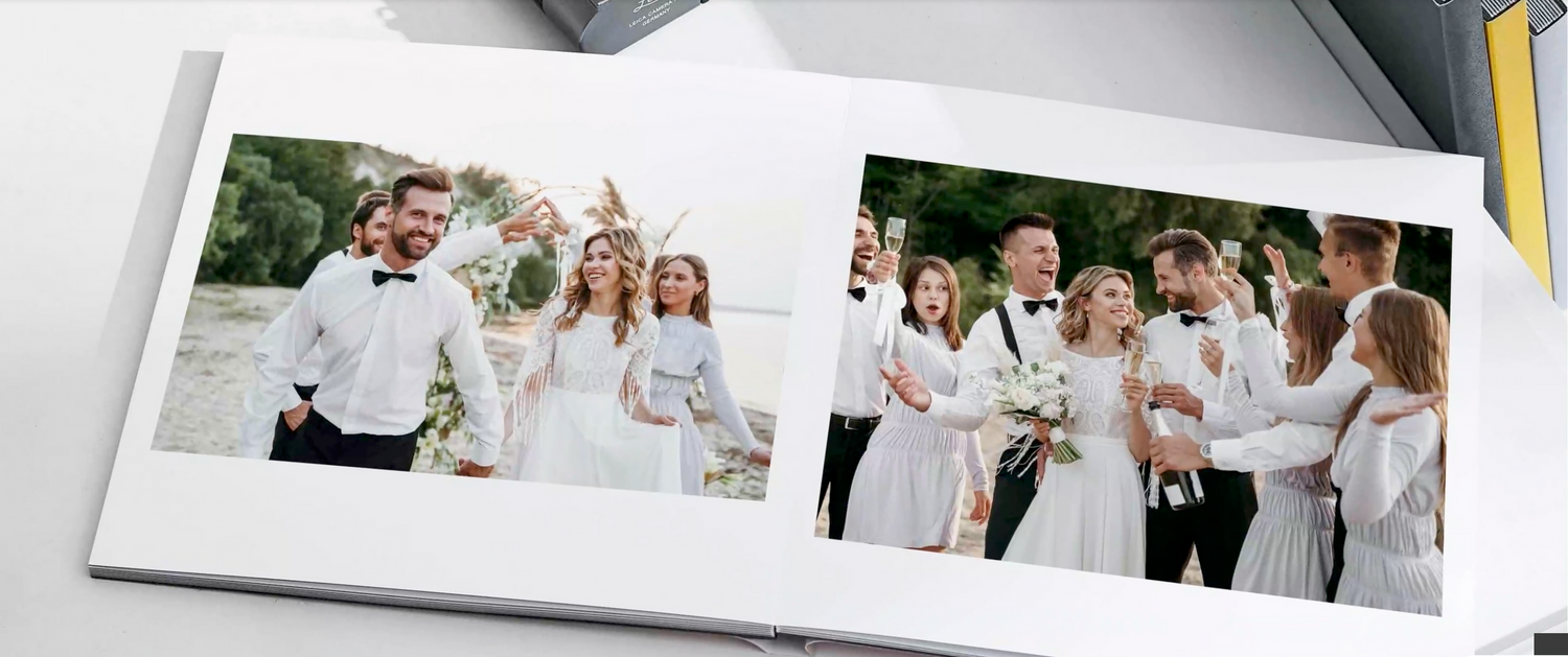 A wedding photo album displaying celebration images with groups in white attire.